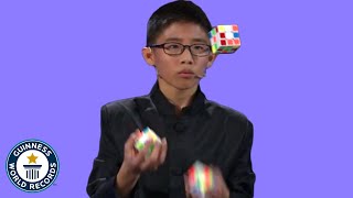 He JUGGLED and SOLVED 3 Rubiks cubes  Guinness World Records [upl. by Melas]